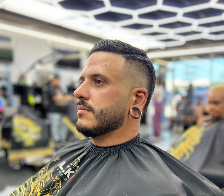Classic side-part fade completed at The Dream Barbershop