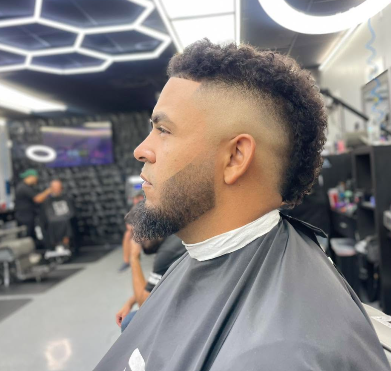 Curly top fade with a shaped beard completed at The Dream Barbershop